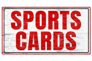 A white-painted distressed wooden sign with red text, "SPORTS CARDS" with a red and black line of frame.